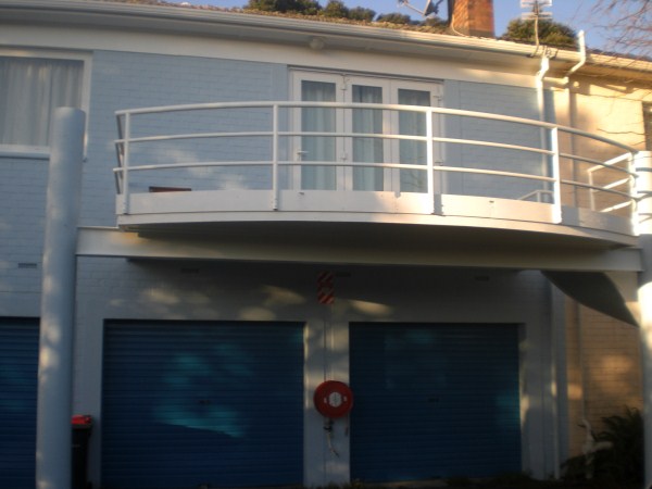 Exterior detail — gutters and edges cleaned and prepared for topcoat